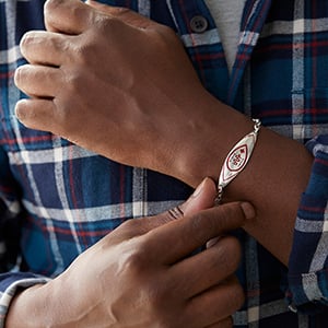 Man wearing Mathew Nuqingaq - Qayaq Bracelet Red