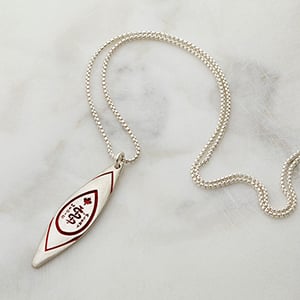 Mathew Nuqingaq - Qayaq Necklace Red on stone background