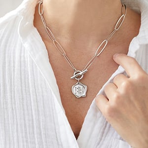 Woman wearing Corrine Anestopoulos - Arden Lariat Rhodium Plate with Sterling Silver Medallion
